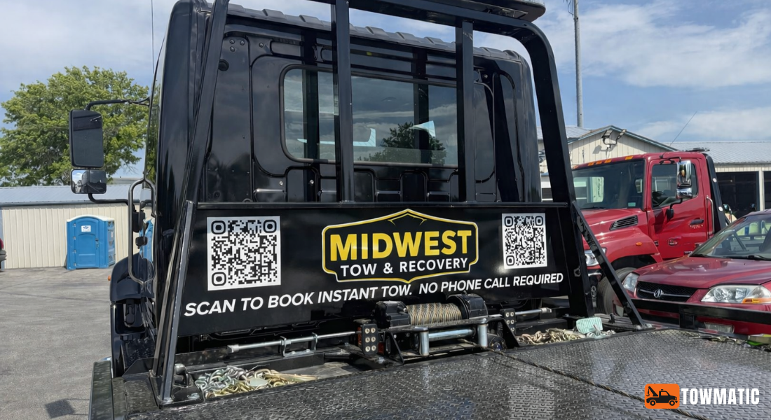 Midwest Tow & Recovery QR code on flatbed truck door